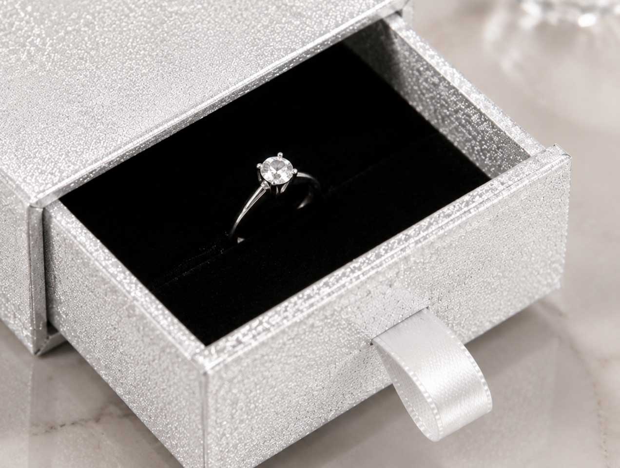 The pull-out drawer design with satin ribbon offers a smooth opening experience, suitable for luxury jewelry collections and gift packaging.